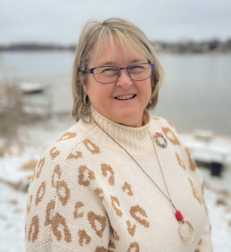 Laurie-Huber-Headshot-2022-scaled-e1672242313612-768x837